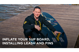 Inflate your Sup board, installing leash and fins. 